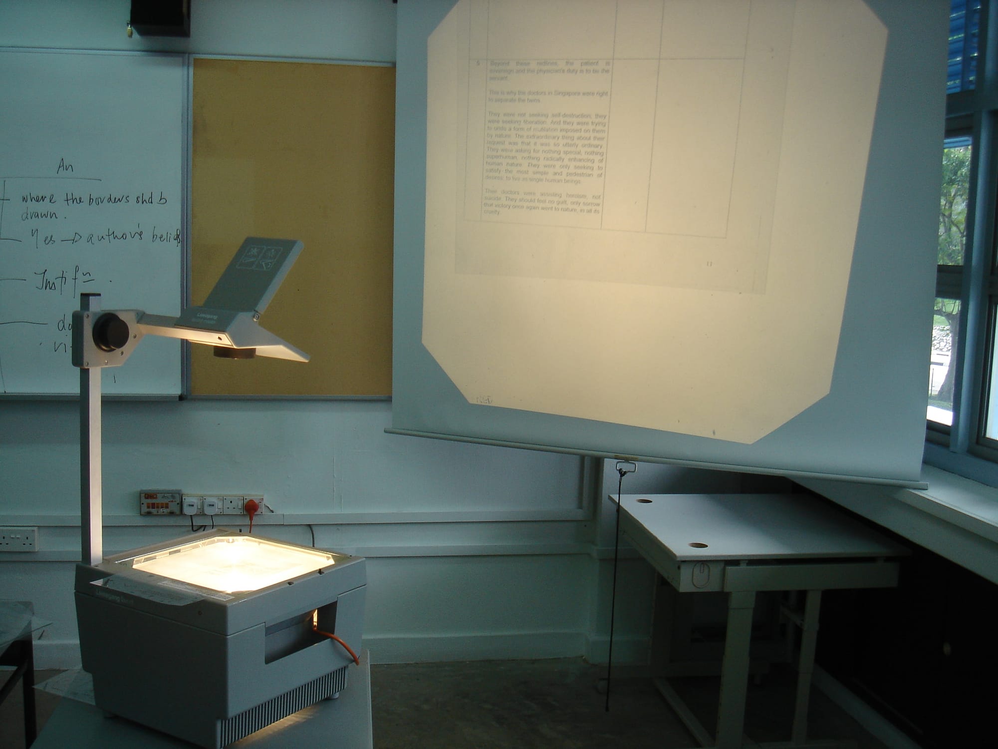 Overhead projector in operation, with a transparency being flashed